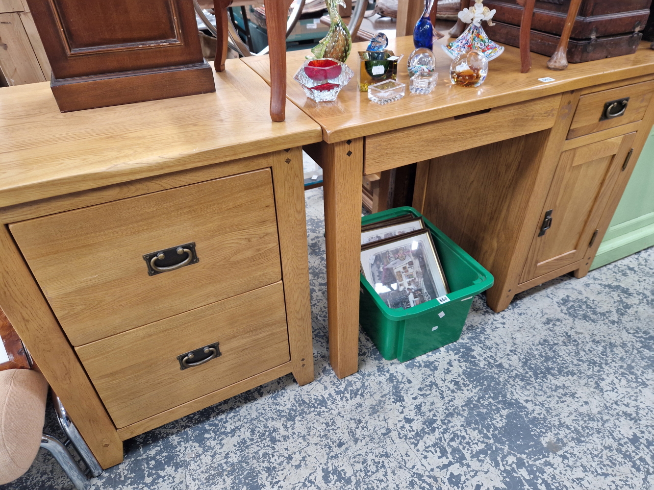 A 20th C. OAK DESK WITH A DRAWER ABOVE A DOOR TO ONE SIDE AND TOGETHER WITH A TWO DRAWER FILING