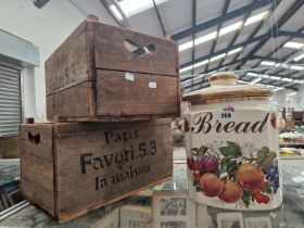 A POTTERY BRAD BIN AND COVER TOGETHER WITH TWO WOODEN CRATES