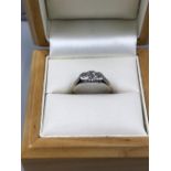 A VINTAGE PLATINUM AND 9ct STAMPED THREE STONE DIAMOND RING. FINGER SIZE L 1/2. WEIGHT 1.57grms.