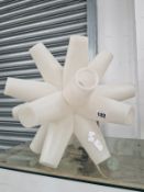 A WHITE PLASTIC STAR SHAPED ORNAMENTAL LAMP SUPPORT