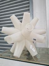 A WHITE PLASTIC STAR SHAPED ORNAMENTAL LAMP SUPPORT