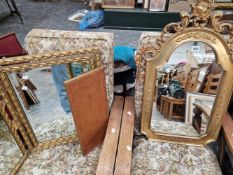 A GILT FRAMED WALL MIRROR AND A DRESSING TABLE MIRROR.