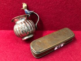 A DUTCH BRASS TOBACCO BOX AND A MEXICAN SMALL JUG