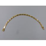 A GREEK AND PANEL BRACELET, UNHALLMARKED, STAMPED 585, ASSESSED AS 14ct GOLD. LENGTH 19cms. WEIGHT