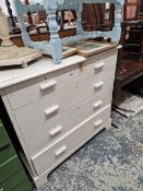 AN ANTIQUE PAINTED PINE CHEST OF DRAWERS AND A PAINTED STANDARD LAMP.