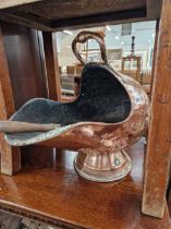 A COPPER COAL SCUTTLE WITH SHOVEL AND TOGETHER WITH A COPPER PLANTER WITH FOUR IRON SUSPENSION BARS