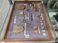 A FRAMED COLLECTION OF ROMAN ARTIFACTS