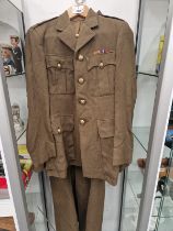 A ROYAL ARMY SERVICE CORPS KHAKI JACKET AND GREAT COAT