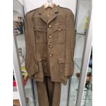 A ROYAL ARMY SERVICE CORPS KHAKI JACKET AND GREAT COAT