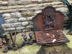 A CAST IRON FIRE BACK TOGETHER WITH TWO FIRE GRATES AND TWO PAIRS OF FIRE DOGS.