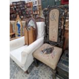 A CARVED FRAME HIGH BACK CHAIR AND A VICTORIAN ARMCHAIR.