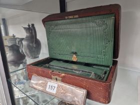 A VICTORIAN DICED BROWN LEATHER DRESSING BOX WITH A GREEN FITTED INTERIOR
