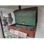 A VICTORIAN DICED BROWN LEATHER DRESSING BOX WITH A GREEN FITTED INTERIOR