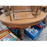 A VICTORIAN PINE OVAL TOPPED DINING TABLE