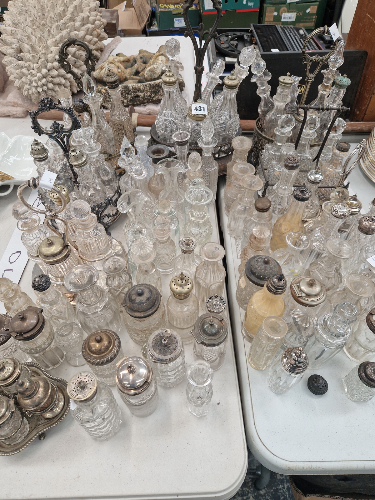 A COLLECTION OF ELECTROPLATE MOUNTED GLASS CRUET BOTTLES TOGETHER WITH WOODEN TROPHY CUP STANDS