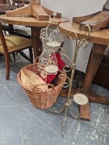 A LOG BASKET, A BRASS CANDLE STAND TOGETHER WITH A WIRE WORK MANNEQUIN