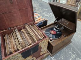 AN OAK CASED HMV WIND UP GRAMOPHONE TOGETHER WITH WOODEN CHEST OF 75RPM RECORDS