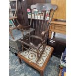 A STICK BACK ROCKING CHAIR TOGETHER WITH A TILED TOP COFFEE TABLE