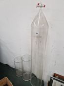 A LARGE GLASS FUNNEL AND TWO CYLINDER VASES