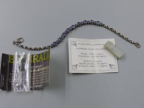 A HALLMARKED SILVER TANZANITE BRACELET, APPROXIMATE GEMSTONE WEIGHT 3.30cts, LENGTH 20cms, WEIGHT