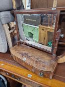 A GEORGE III MAHOGANY DRESSING TABLE MIRROR SUPPORTED ON A THREE DRAWER BASE