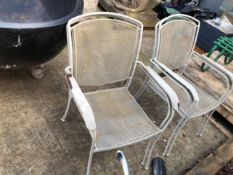 A SET OF FOUR PAINTED PATIO ARMCHAIRS
