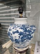 A CHINESE BLUE AND WHITE JAR MOUNTED AS A TABLE LAMP