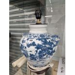 A CHINESE BLUE AND WHITE JAR MOUNTED AS A TABLE LAMP