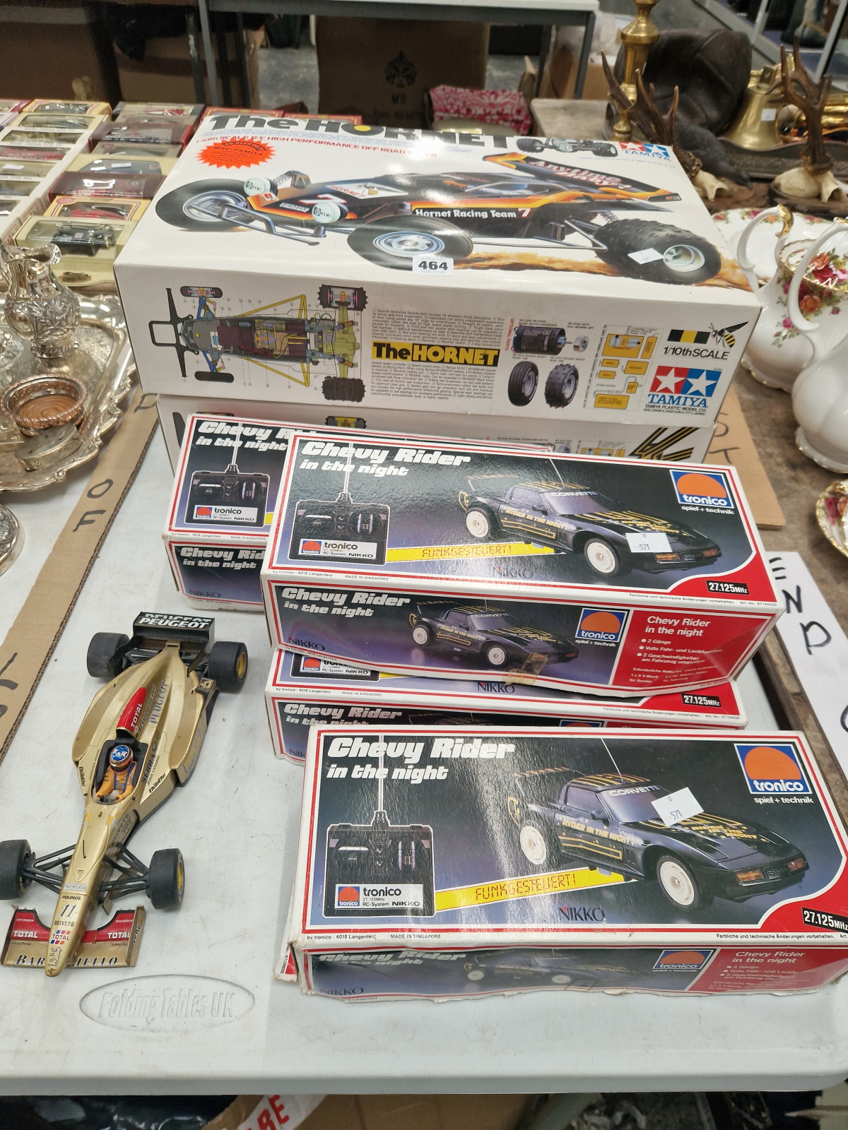 FOUR BOXED TRONICO REMOTE CONTROLLED CARS TOGETHER WITH TWO BY TAMIYA