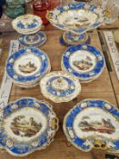 A 19th C. ENGLISH PORCELAIN DESSERT SERVICE PAINTED WITH LANDSCAPES WITHIN GILT BLUE BANDS