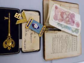 A GILDED CASED KEY, ENGRAVED MAR 1st 1928, OPENED BY MISS E.M. THOMPSON, THE REVERSE WESLEYAN