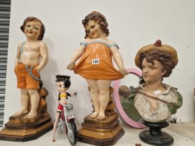 FIGURES OF A BOY AND A GIRL WEARING ORANGE CLOTHING, A BUST OF A CHILD TOGTHER WITH BETTY BOOP