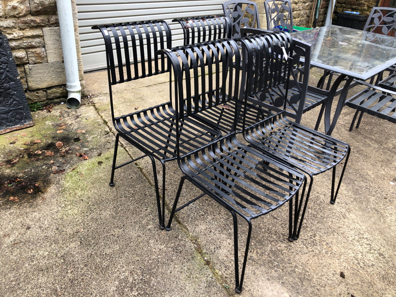 FOUR METAL GARDEN CHAIRS