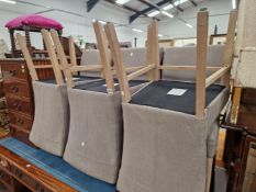 A SET OF SIX LIMED OAK CHAIRS WITH GREY UPHOLSTERED BACKS AND SEATS