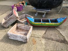 A DRIFT WOOD BOAT FORM GARDEN PLANTER, TOGETHER WITH THREE SIMILAR RECTANGULAR PLANTERS (4)