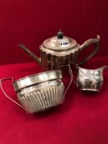 A GEORGIAN SILVER TEAPOT, A CREAMER AND A LARGE SUGAR BOWL.