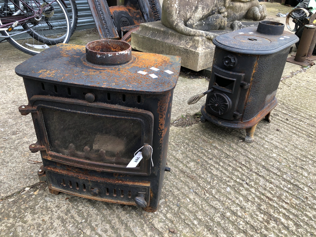 TWO CAST IRON WOOD BURNERS