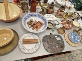 A CHINESE COPPER FAN SHAPED PANEL, INSCRIBED AND WORKED WITH LOTUS, TWO OIL LAMPS, VARIOUS BOWLS,