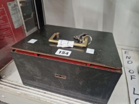 AN IRON STRONGBOX AND KEY