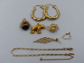 GOLD JEWELLERY TO INCLUDE A PAIR OF HOOP EARRINGS, A HARDSTONE SPINNING FOB, TWO CHARMS, ETC.