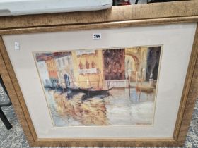 A GOLD FRAMED PICTURE OF A VENETIAN CANAL