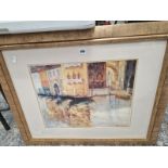 A GOLD FRAMED PICTURE OF A VENETIAN CANAL