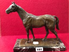 A BRONZE FIGURE OF A HORSE SIGNED INDISTINCTLY.