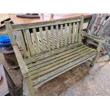 A WOODEN GARDEN BENCH