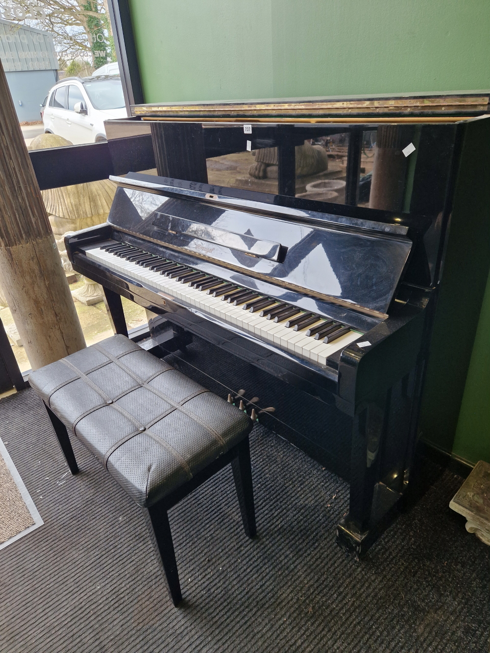 A HORUGEL OVERSTRUNG UPRIGHT PIANO WITH STOOL