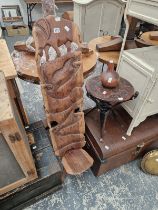 AN ETHNIC ELEPHANT CARVED HIGH BACKED STOOL, A TABLE, THREE WOODEN SPOONS, A GOURD, ETC