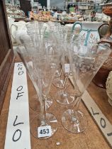 A SET OF TWELVE FOLIAGE ENGRAVED GLASS FLUTES