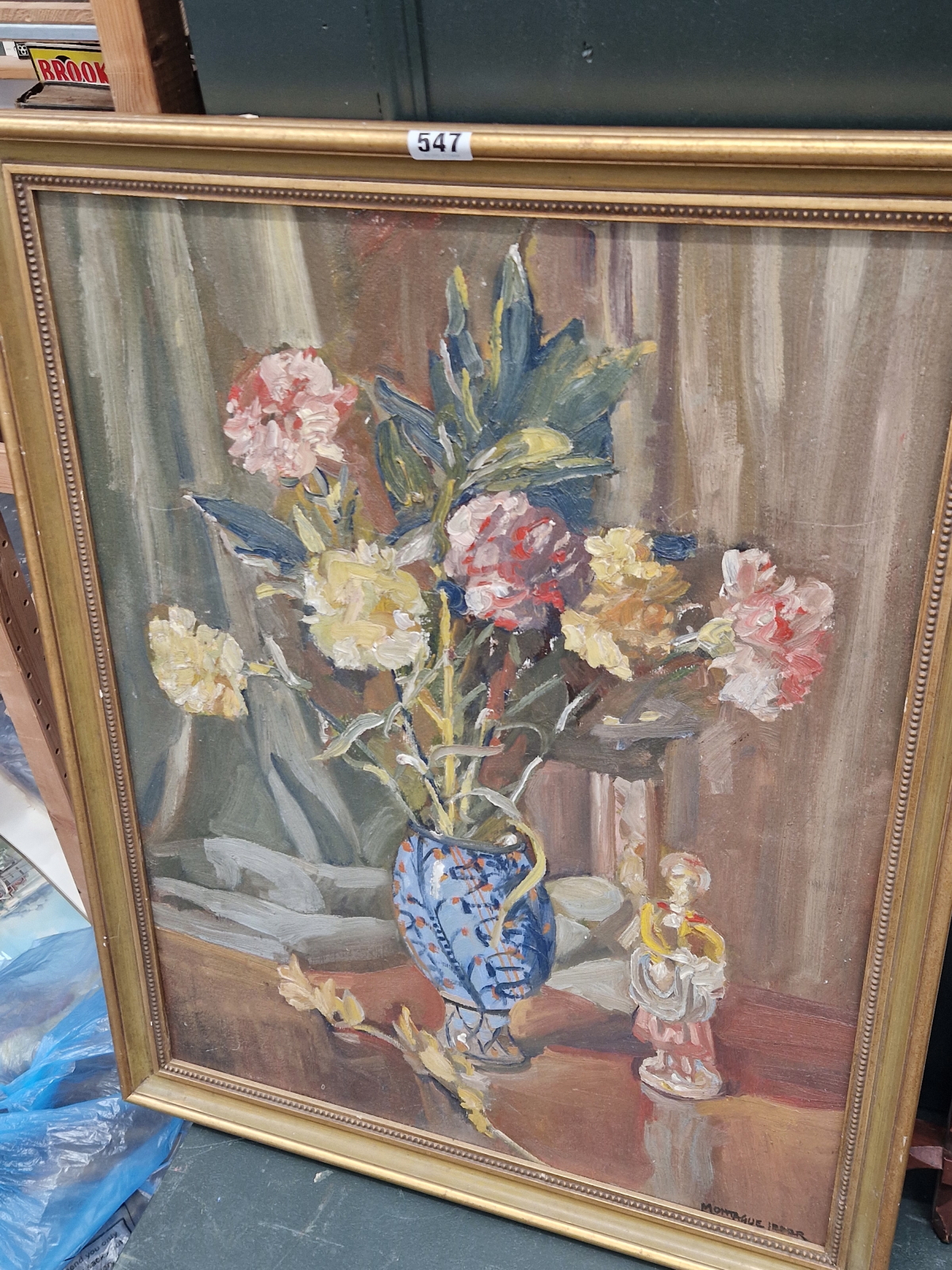 MONTAGUE LEDER, A STILL LIFE OF A VASE OF FLOWERS BY A PORCELAIN FIGURE, OIO ON BOARD, SIGNED