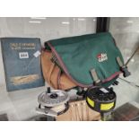 A FISHING BAG CONTAINING ACCESSORIES, TWO FLY FISHING REELS AND A BOOK: TROUT FISHING BY EARL
