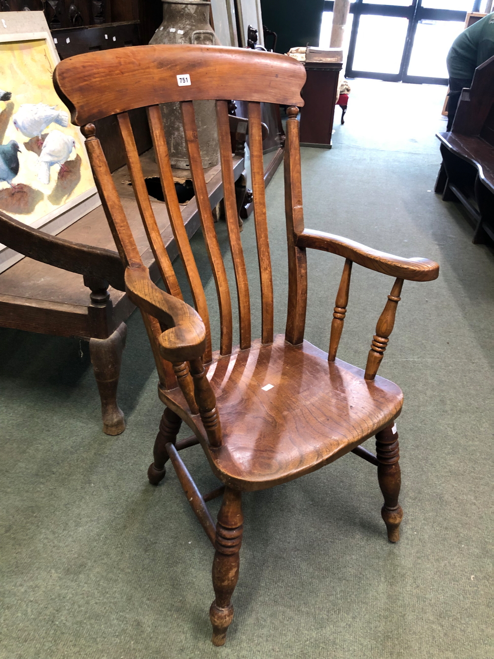 A SLAT BACK KITCHEN ARMCHAIR.